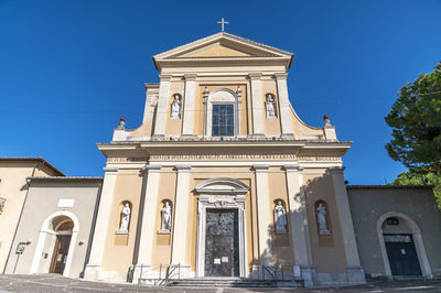 Low angle view of building against blue sky