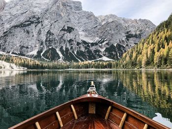 Scenic view of lake by snowcapped mountains