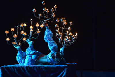 Low angle view of illuminated statue at night