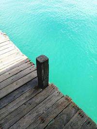 High angle view of wooden pier over sea