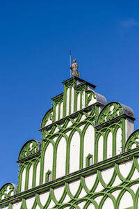 Low angle view of building against clear blue sky