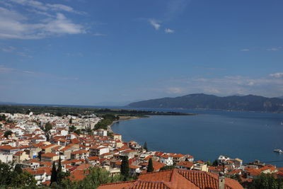 High angle view of townscape by sea
