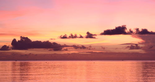 Scenic view of sea against sky at sunset