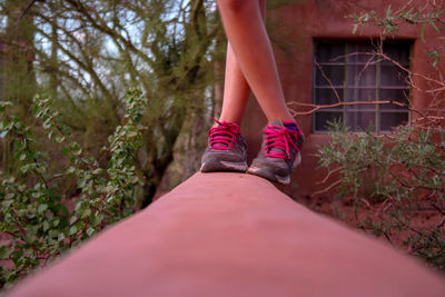 Low section of woman standing on floor