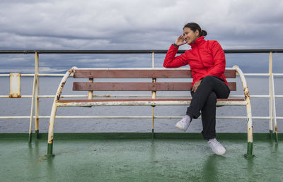 Woman relaxing on a passenger vessel traveling in south america