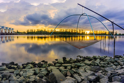 Scenic view of lake against sky during sunset