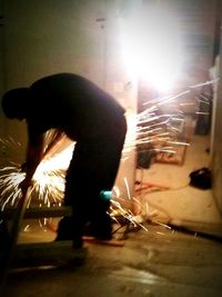 View of illuminated woman at night