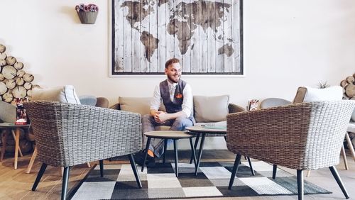 Man sitting on sofa at table