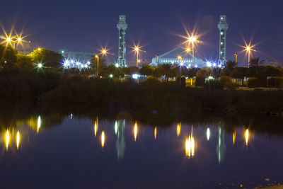 Panoramic view of illuminated city against sky at night