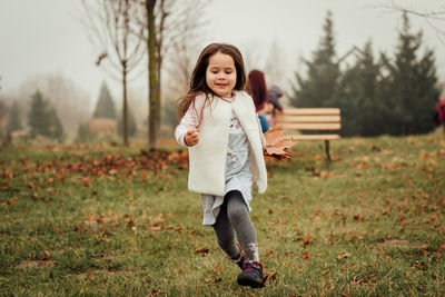 Full length of girl on field