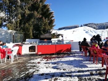 View of ski lift against snowcapped mountain