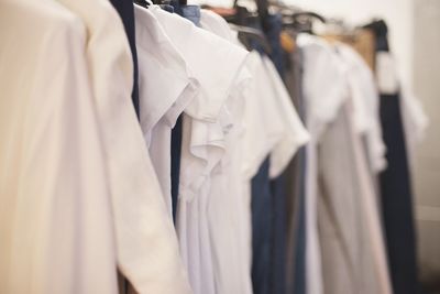 Close-up of clothes hanging on store