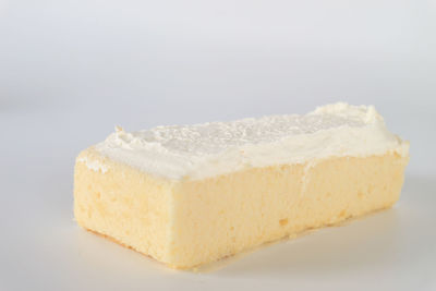 Close-up of cake against white background