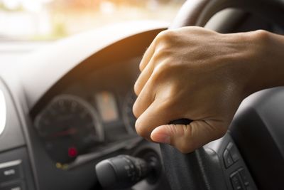 Close-up of hand holding car