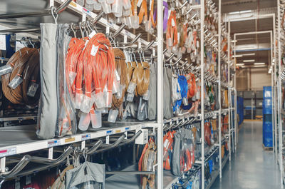 Shelves with skeins of colored car cables. industrial details. side view