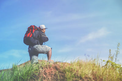 Full length of senior man on field against sky