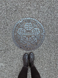 Low section of person standing on street