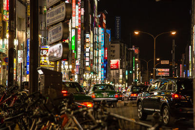 Cars on illuminated city at night