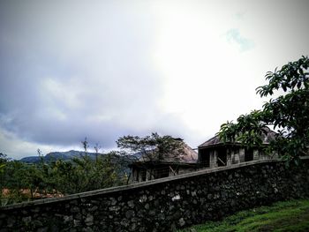 Built structure against cloudy sky