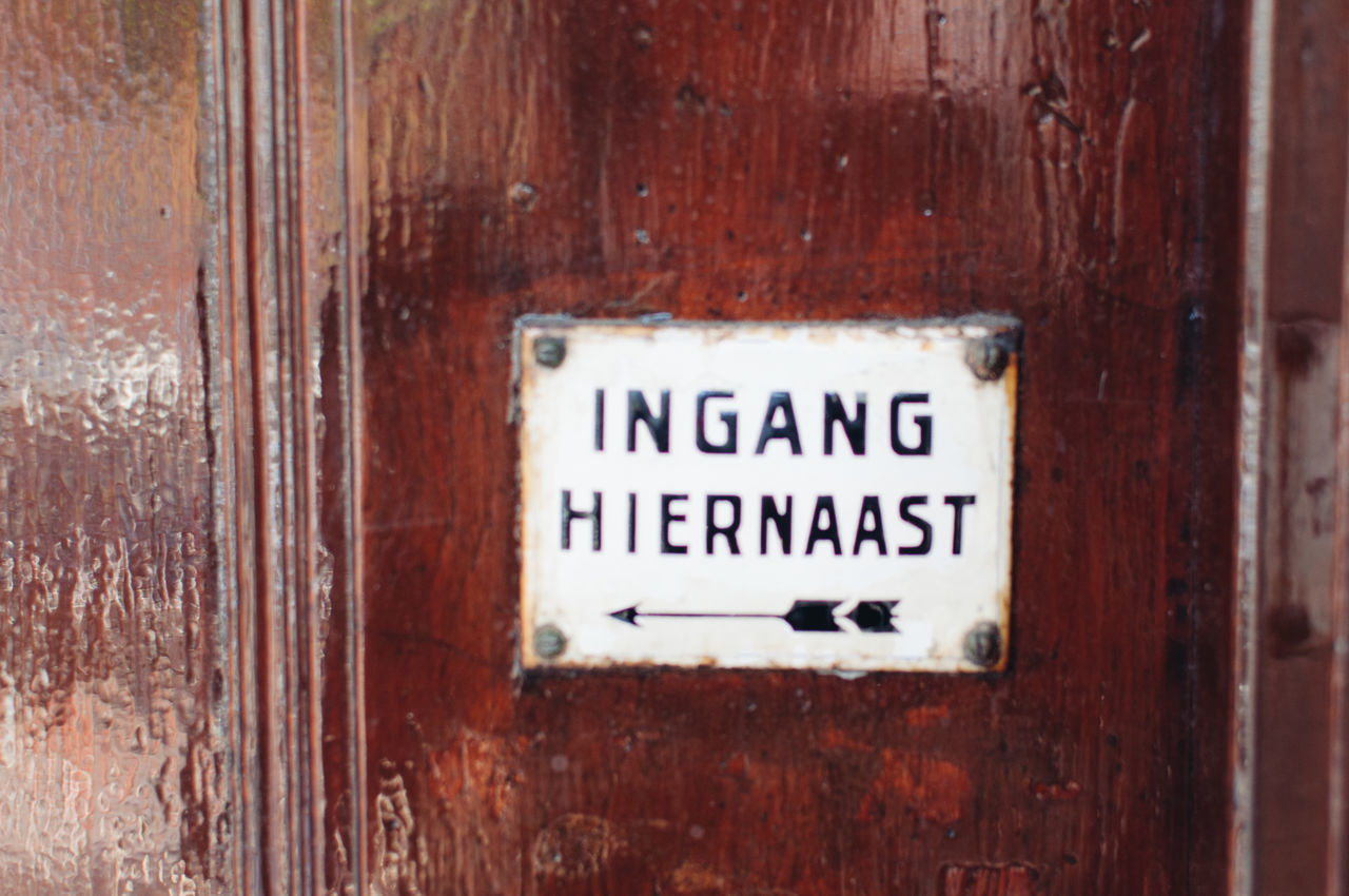 text, western script, communication, door, close-up, wood - material, day, no people, outdoors, nameplate