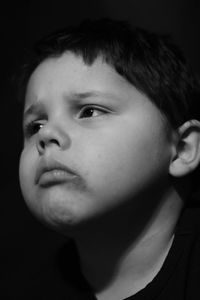 Close-up portrait of boy looking away