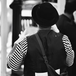 Rear view of mime on street