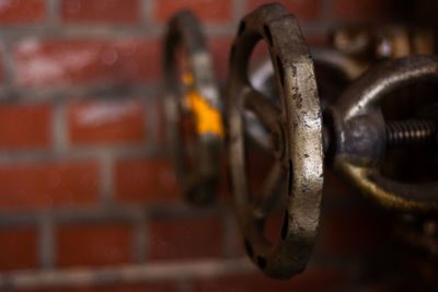 Close-up of rusty metal against wall