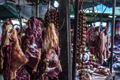 Clothes hanging in store for sale at market stall