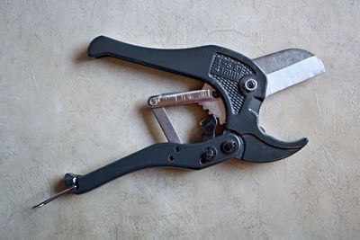 High angle view of equipment on table against wall