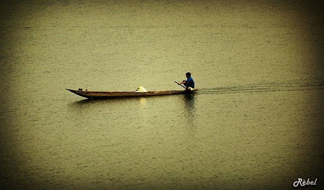 men, lifestyles, transportation, leisure activity, mode of transport, nautical vessel, boat, full length, copy space, water, travel, waterfront, person, high angle view, day, outdoors, bicycle