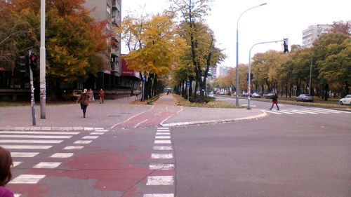 People walking on road in city