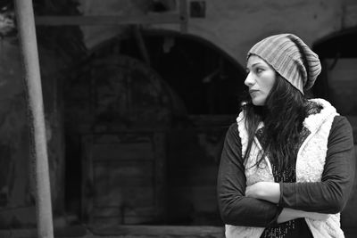 Portrait of young woman standing outdoors