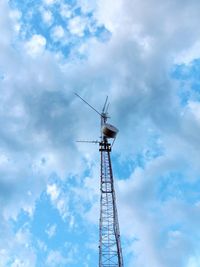Low angle view of windmill against sky