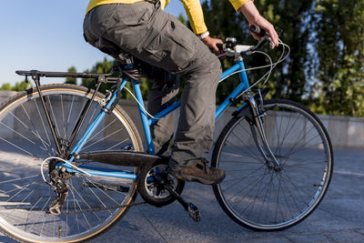 Unrecognizable man riding bicycle in the city