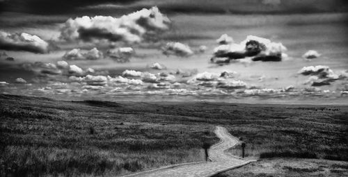 Road on field against sky