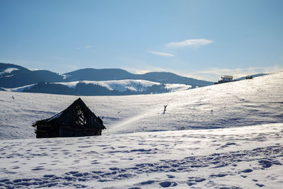 Sun over the winter mountains with snow, cindrel mountains, paltinis, romania