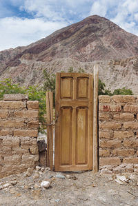 Built structure on mountain against sky