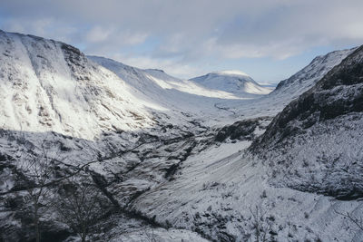 Scenic view of mountains against sky during winter