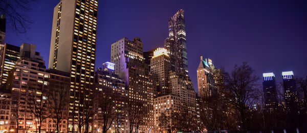 Low angle view of illuminated buildings in city