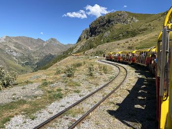 Train on railroad track against sky