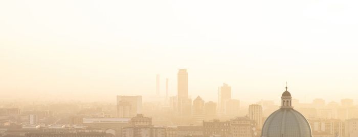 Buildings in city against sky