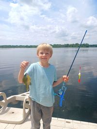 A boy's 1st fishing catch