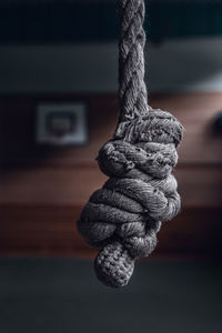 Close-up of rope tied on wood