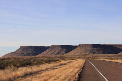 Scenic view of mountain road against sky