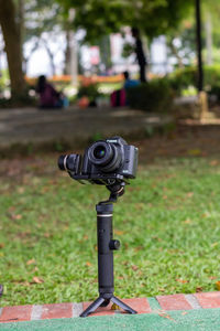 Close-up of digital camera on footpath