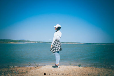 Rear view of person standing on beach