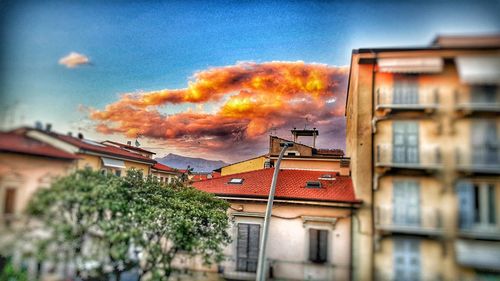 Low angle view of buildings against sky during sunset