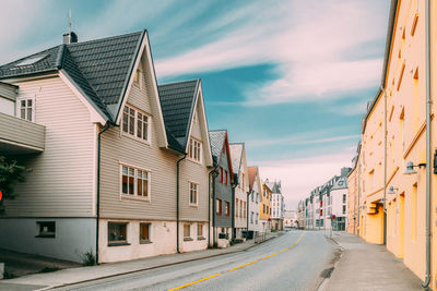 Street amidst buildings against sky