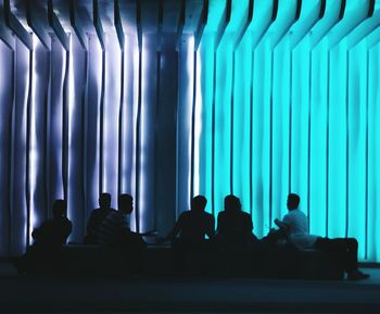 Group of people sitting in the dark room