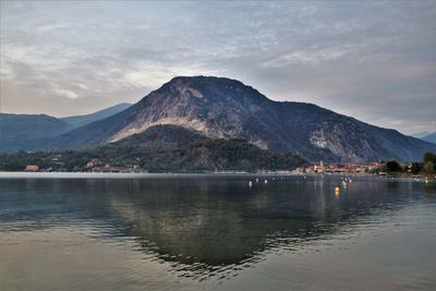 Scenic view of lake against cloudy sky